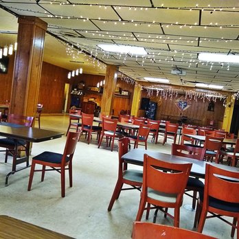 Saborico - a restaurant with tables and chairs - Puerto Rican Near Me - Detroit, Michigan