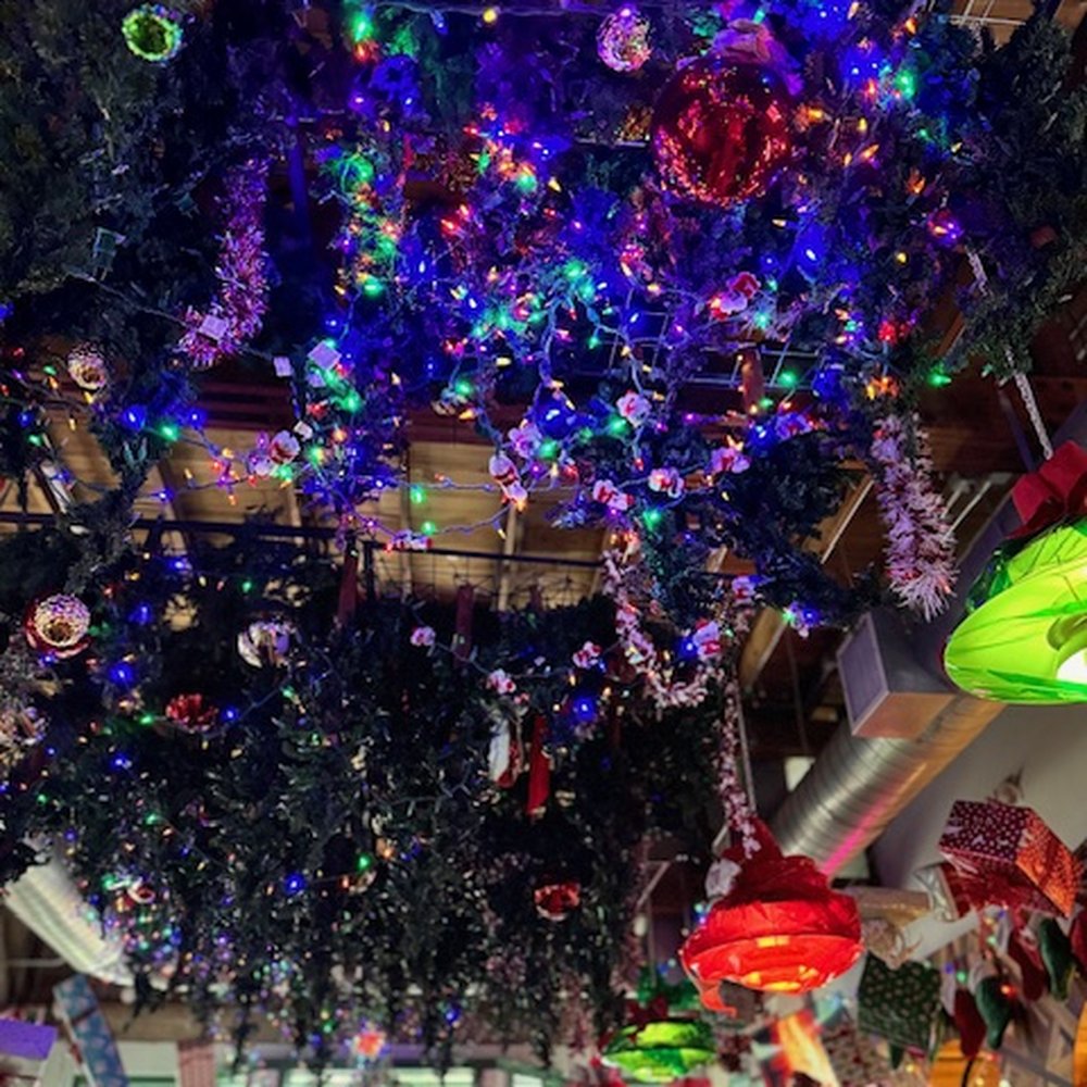 Winnie's - The ceiling is very festive with lights and tinsel. - Cocktail Bars Near Me - Houston, Texas Winnie's - The ceiling is very festive with lights and tinsel. - Cocktail Bars Near Me - Houston, Texas