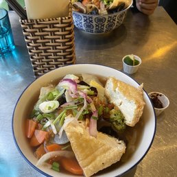 a bowl of soup and a sandwich