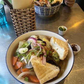 Oxtail Pho & Banh Mi - a bowl of soup and a sandwich - Vietnamese Near Me - Toronto, Ontario