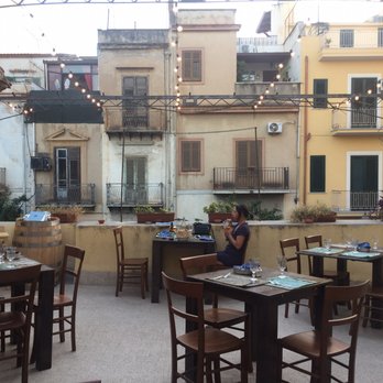 Bitta Ristro - This patio looks out over a 'stage' on the street and buildings across the way. - Seafood Near Me - Bagheria, Pennsylvania