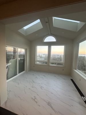 Sunroom Addition Snoqualmie - Sunroom Addition with Heated Tile Floors – Snoqualmie, WA | Moses Field Remodeling & Design
This sunroom addition in Snoqualmie blends comfort, craftsmanship, and stunning natural views — designed to function beautifully year-round with a cozy, radiant-heated tile floor and a flood of natural light.
What began as an exterior-facing space has now become a bright, open retreat with panoramic mountain and forest views, vaulted ceilings, and custom skylights that bring in daylight from every angle. The architecture is anchored by a half-moon clerestory window that adds a sense of elegance and height to the gable-style ceiling.
We installed large-format porcelain tiles with a soft marble-look finish for durability and elegance. Beneath the surface, we laid a premium Schluter underlayment system with radiant electric heat to provide efficient, evenly distributed warmth — ensuring this space stays inviting even in the middle of a Pacific Northwest winter.
Natural wood tones, horizontal shiplap walls, recessed LED lighting, and a modern ceiling fan give this room a polished, timeless look. Custom windows and sliding doors frame the stunning Snoqualmie landscape, making this a perfect space for morning coffee, reading, or entertaining guests year-round.
Our team handled all framing, insulation, tilework, electrical, and HVAC integration — delivering a seamless, permitted, and fully code-compliant sunroom addition that looks and feels like it was always part of the home.
Whether you’re envisioning a cozy sunroom, four-season room, or peaceful bonus space with a view, Moses Field Remodeling & Design has the expertise to design and build your perfect escape — right in your own home. Sunroom Addition Snoqualmie - Sunroom Addition with Heated Tile Floors – Snoqualmie, WA | Moses Field Remodeling & Design
This sunroom addition in Snoqualmie blends comfort, craftsmanship, and stunning natural views — designed to function beautifully year-round with a cozy, radiant-heated tile floor and a flood of natural light.
What began as an exterior-facing space has now become a bright, open retreat with panoramic mountain and forest views, vaulted ceilings, and custom skylights that bring in daylight from every angle. The architecture is anchored by a half-moon clerestory window that adds a sense of elegance and height to the gable-style ceiling.
We installed large-format porcelain tiles with a soft marble-look finish for durability and elegance. Beneath the surface, we laid a premium Schluter underlayment system with radiant electric heat to provide efficient, evenly distributed warmth — ensuring this space stays inviting even in the middle of a Pacific Northwest winter.
Natural wood tones, horizontal shiplap walls, recessed LED lighting, and a modern ceiling fan give this room a polished, timeless look. Custom windows and sliding doors frame the stunning Snoqualmie landscape, making this a perfect space for morning coffee, reading, or entertaining guests year-round.
Our team handled all framing, insulation, tilework, electrical, and HVAC integration — delivering a seamless, permitted, and fully code-compliant sunroom addition that looks and feels like it was always part of the home.
Whether you’re envisioning a cozy sunroom, four-season room, or peaceful bonus space with a view, Moses Field Remodeling & Design has the expertise to design and build your perfect escape — right in your own home.