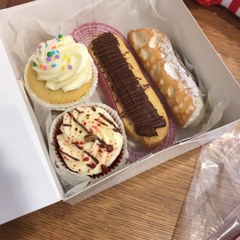 Carlo's Bakery - Butter cream cupcake, red velvet cupcake, chocolate eclair and cannoli :) YUMM!!!!!!! - Bakeries Near Me - Hoboken, New Jersey
