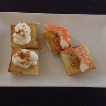 Amayra - mini tapas from our dinner at their cafe: toast points with a fish foam on the left and shrimps on the right - Mediterranean Near Me - Madrid, M