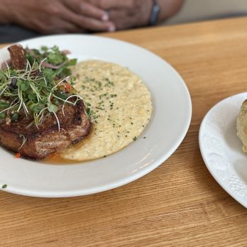 Colleen's Kitchen - Sweet tea brined pork chop and grits. - Southern Near Me - Austin, Texas