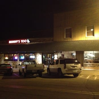 Manny's Too - the outside of a restaurant at night - Pizza Near Me - Fulton, Illinois