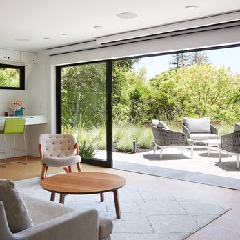 ORB Construction - a living room with sliding glass doors - General Contractors Near Me ORB Construction - a living room with sliding glass doors - General Contractors Near Me