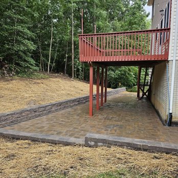 Green Cricket Landscaping - Under deck patio with retaining wall. - Landscaping Near Me - Lexington Park, Maryland