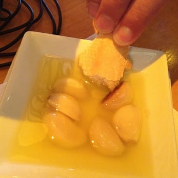 Embargo - Garlic soaking in Olive Oil with Bread. Yum! - Tapas Bars Near Me - Hyannis, Massachusetts Embargo - Garlic soaking in Olive Oil with Bread. Yum! - Tapas Bars Near Me - Hyannis, Massachusetts