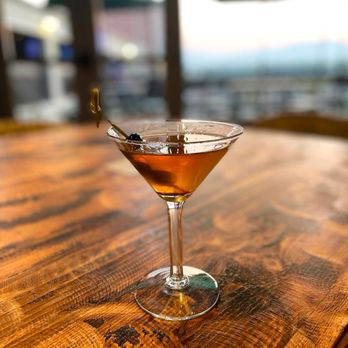 Angry Horse Eatery - a martini on a wooden table - American Near Me - Superior, Colorado Angry Horse Eatery - a martini on a wooden table - American Near Me - Superior, Colorado