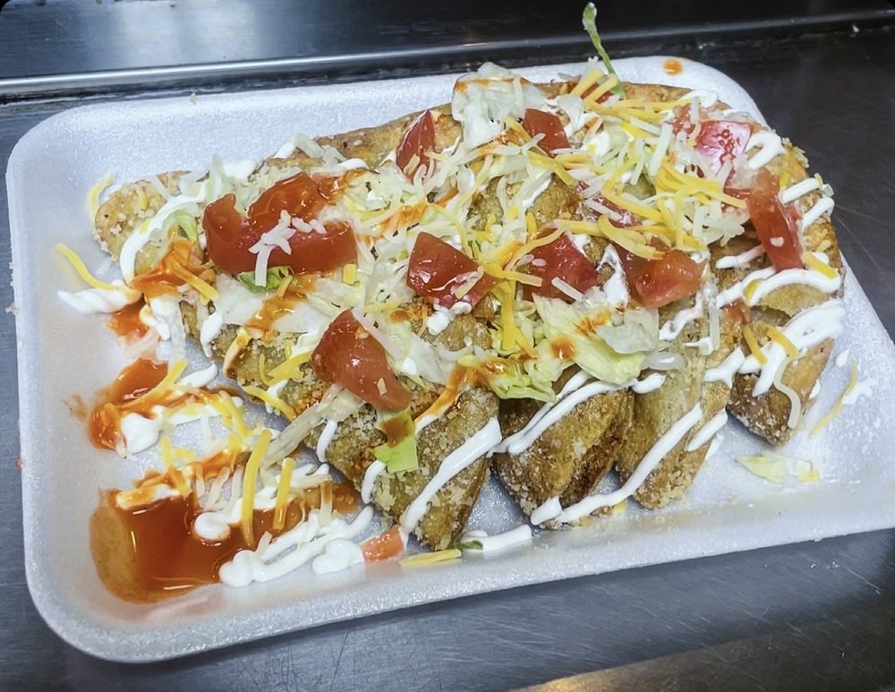 Abuelito Ricos Crispy Tacos Logo