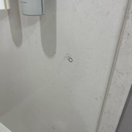 Hair on the bath tub wall.