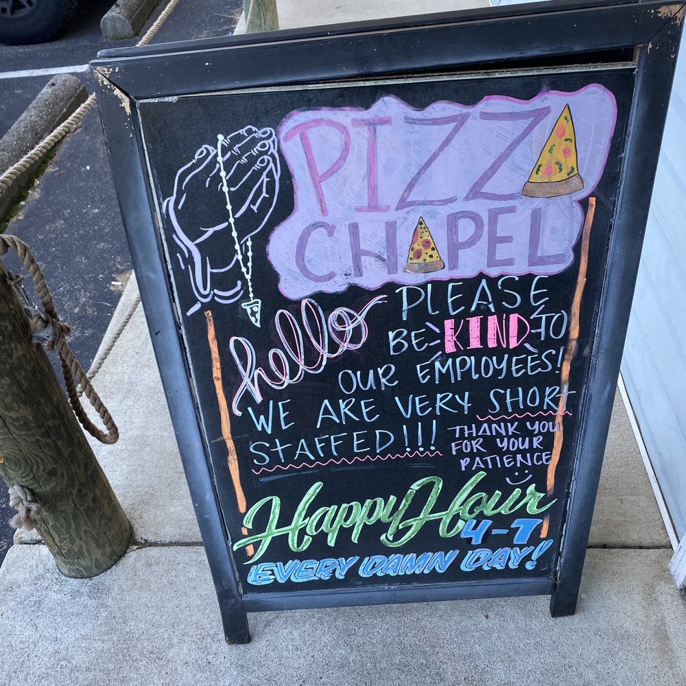 Pizza Chapel - a chalkboard sign on a sidewalk - Bars Near Me - Virginia Beach, Virginia Pizza Chapel - a chalkboard sign on a sidewalk - Bars Near Me - Virginia Beach, Virginia