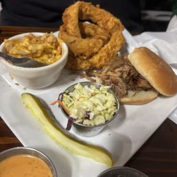 Pulled pork, onion rings, and cheesy potatoes.