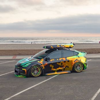 AIM Wrap Studio - A mid 3 quarters photo showing how the creativeness from the side to the front and he even mimicked the design with the roofbox! - Auto Customization Near Me - Los Angeles, California