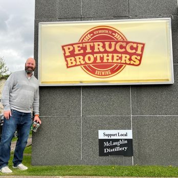 Petrucci Brothers Brewing - a man standing in front of a building - Breweries Near Me - New Brighton, Pennsylvania