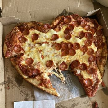 Macy’s Place Pizzeria - Heart shaped pepperoni pizza minus a piece of - Pizza Near Me - Kenmore, New York