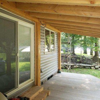 Emils Property Services - the porch of a log home - General Contractors Near Me - Starksboro, Vermont Emils Property Services - the porch of a log home - General Contractors Near Me - Starksboro, Vermont
