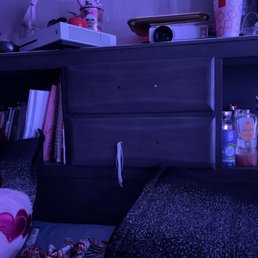 Here is the drawers on her headboard that clearly shows no handles on the outside of the drawers. Here is the drawers on her headboard that clearly shows no handles on the outside of the drawers.