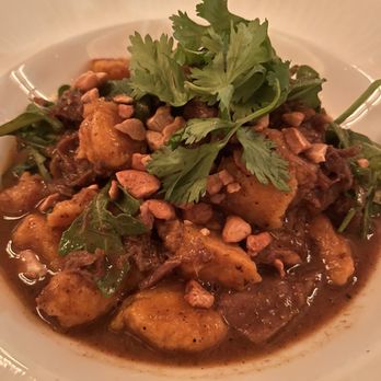 Compère Lapin - Curried goat with sweet potato gnocchi - Caribbean Near Me - New Orleans, Louisiana