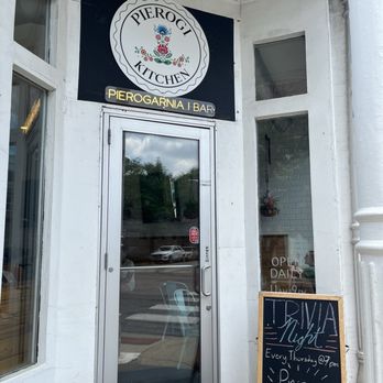 Pierogi Kitchen - Pierogi Kitchen's exterior includes a sign with the logo and name, a glass door, and a chalkboard promoting trivia night every Thursday. - Polish Near Me - Chicago, Illinois