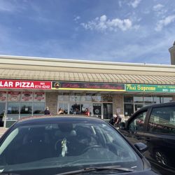 Bella Sicilia Bakery  - Exterior in a small strip plaza that has a Starbucks drive-thru