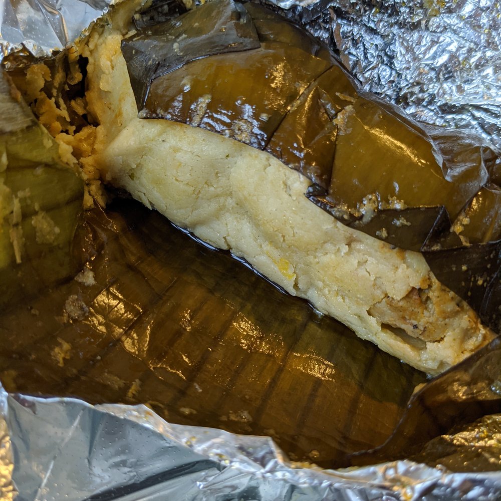 Pork Tamale: seasoned corn dough and vegetables wrapped in banana leaf Pork Tamale: seasoned corn dough and vegetables wrapped in banana leaf