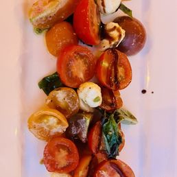 caprice salad, heavy on the tomatoes light on the mozzarella. caprice salad, heavy on the tomatoes light on the mozzarella.