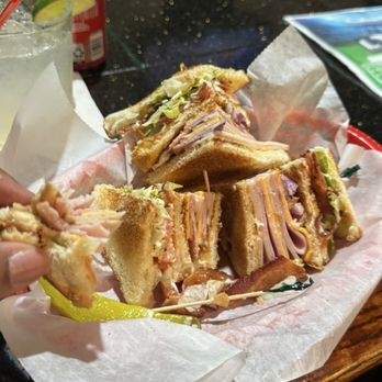 Levels Sports Bar and Grill - The club sandwich combo and I added red onion. It comes with chips and a canned pop. - Sports Bars Near Me - Flint, Michigan Levels Sports Bar and Grill - The club sandwich combo and I added red onion. It comes with chips and a canned pop. - Sports Bars Near Me - Flint, Michigan