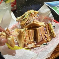 Levels Sports Bar and Grill - The club sandwich combo and I added red onion. It comes with chips and a canned pop.