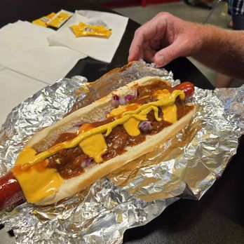 Fat Dogs - Here's their signature Fat Dog hot dog! Delicious with all the fixins! - Gas Stations Near Me - North Platte, Nebraska