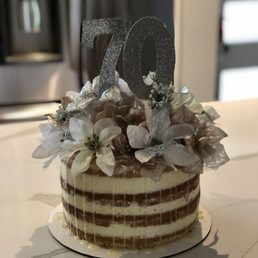 a cake decorated with flowers a cake decorated with flowers