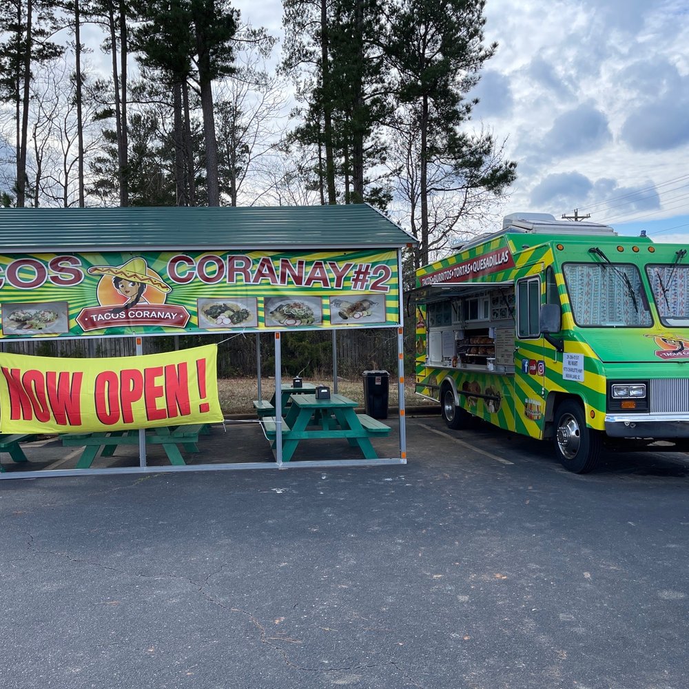 Taco truck and outdoor seating Taco truck and outdoor seating