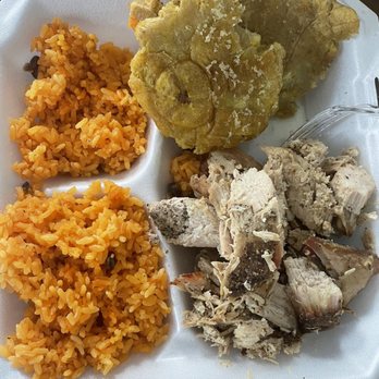 Moncho’s Café - Lechon platter with arroz con gandules - Puerto Rican Near Me - Roselle, Illinois Moncho’s Café - Lechon platter with arroz con gandules - Puerto Rican Near Me - Roselle, Illinois