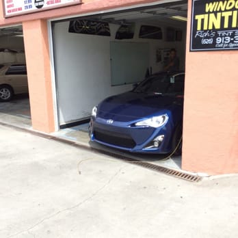 Rich's Tint Shoppe - In the middle of the tinting process. As you can see it's very personalized so he focuses on solely one car at a time. - Car Window Tinting Near Me - Walnut, California Rich's Tint Shoppe - In the middle of the tinting process. As you can see it's very personalized so he focuses on solely one car at a time. - Car Window Tinting Near Me - Walnut, California