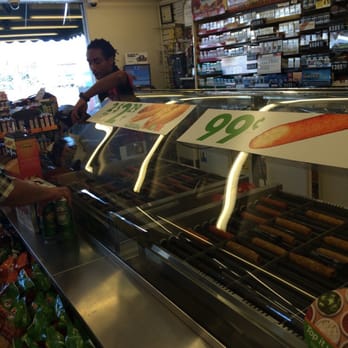 7-Eleven - a woman shopping in a grocery store - Convenience Stores Near Me - Costa Mesa, California