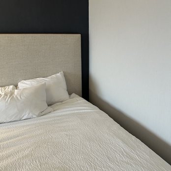 Courtyard by Marriott Boston-South Boston - One of the beds is against a wall, with no light or nightstand - Hotels Near Me - Boston, Massachusetts Courtyard by Marriott Boston-South Boston - One of the beds is against a wall, with no light or nightstand - Hotels Near Me - Boston, Massachusetts