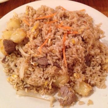 Silver Spoon Thai Restaurant - Chicken Pineapple Fried Rice (stir-fried rice with pineapple, egg, onions in a traditional thai style) - Thai Near Me - Chicago, Illinois Silver Spoon Thai Restaurant - Chicken Pineapple Fried Rice (stir-fried rice with pineapple, egg, onions in a traditional thai style) - Thai Near Me - Chicago, Illinois