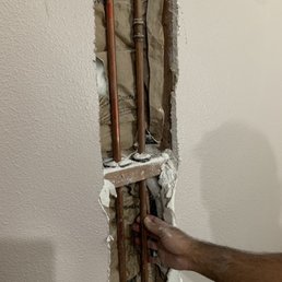The shark bite where they cut and clamped the pipe and the finger punch is the new pin hole! The shark bite where they cut and clamped the pipe and the finger punch is the new pin hole!