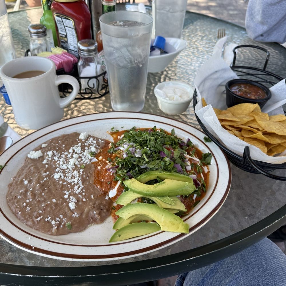 Jerry's grill - Huevos Rancheros w/extra red onion, cilantro, avocado, sour cream, salsa and freshly fried tortilla chips (best breakfast ever...!) - Breakfast & Brunch Near Me - Gardnerville, Nevada