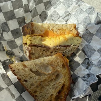 Flatbread & Butter - Egg, bacon, cheese on sourdough with chipotle sauce - Bakeries Near Me - Tampa, Florida Flatbread & Butter - Egg, bacon, cheese on sourdough with chipotle sauce - Bakeries Near Me - Tampa, Florida