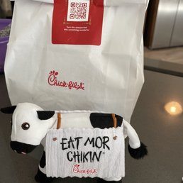 ows a cow with a sign attached to it