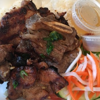 Hot Pho - Combination Rice Plate has grilled chicken, grill pork chop, and grilled short ribs. - Vietnamese Near Me - Kent, Washington