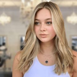 Belle de Jour Salon - Blonding Session with a soft very natural blended root color.