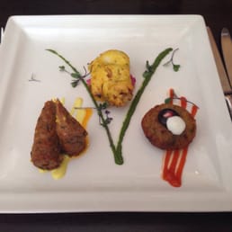 Tasting platter starter. Lamb sheesh kebab, superb chicken & delicious potato cake accompanied by perfectly paired sauces.