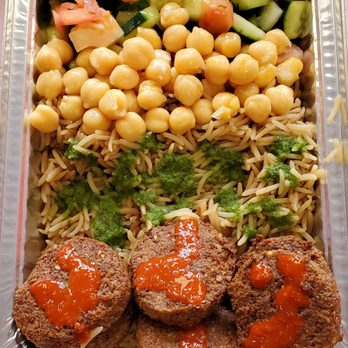 Shah's Halal Food - Falafel over rice, with some tomato & cucumber, chickpeas. Threw some green chutney and some hot sauce on there. Really good. - Halal Near Me - Hauppauge, New York Shah's Halal Food - Falafel over rice, with some tomato & cucumber, chickpeas. Threw some green chutney and some hot sauce on there. Really good. - Halal Near Me - Hauppauge, New York