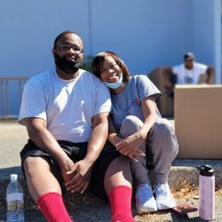 Multicultural Child & Family Hope Center - Executive director Ms. Gail Neal and her son, Brycen, at a summer backpack and school supplies giveaway event.