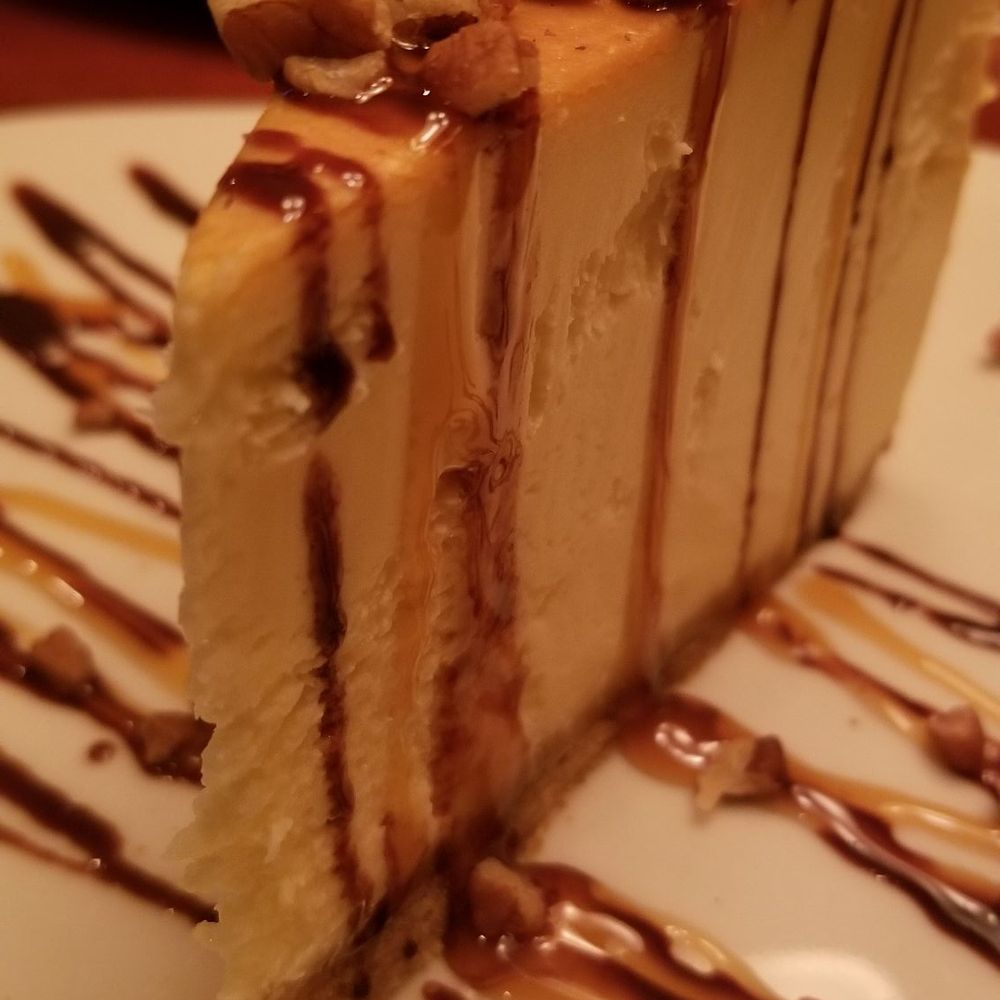 Minervas Restaurant - Sioux Falls - NY style Vanilla cheesecake aaded turtle topping - New American Near Me - Sioux Falls, South Dakota