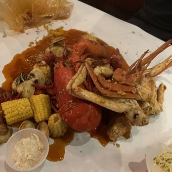 Cap't Loui - You pick four; 2 snow crab, clams and fresh crawfish. Comes free lobster. Also with side of cole slaw. - Seafood Near Me - Braintree, Massachusetts