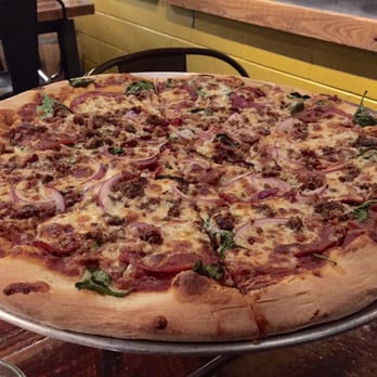 Trophy Brewing - Best Dressed - Pepperoni, Bacon, Lamb Sausage, Spinach, Red onions, Tomato sauce, Mozzarella blend ($22) - Bars Near Me - Raleigh, North Carolina Trophy Brewing - Best Dressed - Pepperoni, Bacon, Lamb Sausage, Spinach, Red onions, Tomato sauce, Mozzarella blend ($22) - Bars Near Me - Raleigh, North Carolina